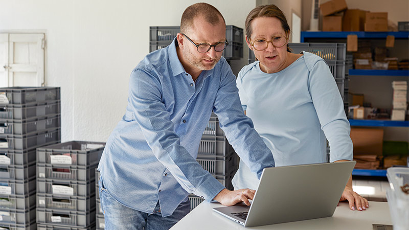 Couple looking at laptop